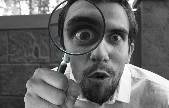 man with a magnifying glass 