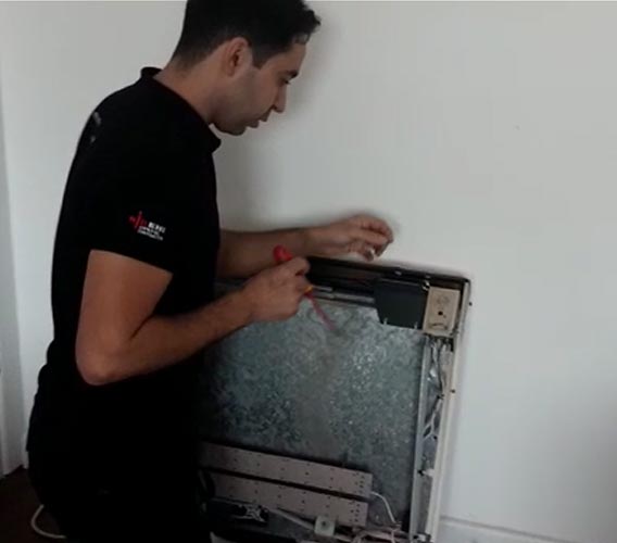 electrician resetting Creda storage heater